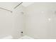 Bright bathroom featuring a tub with white tile and a shower head at 415 Mather Green Ave # I, Charlotte, NC 28203
