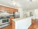 Well-lit kitchen featuring stainless steel appliances and a granite countertop, creating an inviting space at 415 Mather Green Ave # I, Charlotte, NC 28203