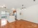 Open concept kitchen and dining area with hardwood floors and recessed lighting at 415 Mather Green Ave # I, Charlotte, NC 28203