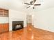Cozy living room with hardwood floors, built-ins, recessed lights and modern fireplace at 415 Mather Green Ave # I, Charlotte, NC 28203