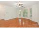 Bright living room featuring a ceiling fan, natural light and hardwood flooring at 415 Mather Green Ave # I, Charlotte, NC 28203