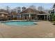 Inviting community pool with a spacious deck area and comfortable lounge chairs at 415 Mather Green Ave # I, Charlotte, NC 28203