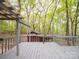 Shaded back porch overlooking the wooded area at 4757 Mountain View Ln, Maiden, NC 28650