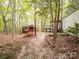 Backyard featuring wooded area, shed, and other structures at 4757 Mountain View Ln, Maiden, NC 28650