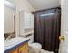 Modest bathroom featuring a shower with a curtain at 4757 Mountain View Ln, Maiden, NC 28650