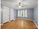 This bedroom features a ceiling fan, and hard wood floors at 4757 Mountain View Ln, Maiden, NC 28650