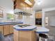 Well-equipped kitchen with central island and a stovetop, offering a practical and efficient cooking space at 4757 Mountain View Ln, Maiden, NC 28650