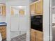 Close-up of the kitchen oven, and saloon doors leading to another room, enhancing cooking and serving convenience at 4757 Mountain View Ln, Maiden, NC 28650