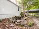Backyard featuring a rock formation with pond and wooded surroundings at 4757 Mountain View Ln, Maiden, NC 28650