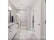 Modern bathroom featuring a glass enclosed shower, double sink vanity, and linen closet at 4831 Looking Glass Trl, Denver, NC 28037