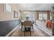 Dining area features a modern chandelier, and a large window with natural light at 4831 Looking Glass Trl, Denver, NC 28037