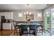 Dining area features a modern chandelier, and a large window with natural light at 4831 Looking Glass Trl, Denver, NC 28037