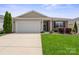 Charming single-Gathering home with a two-car garage, brick accents, and well-maintained landscaping at 4831 Looking Glass Trl, Denver, NC 28037