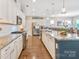 Spacious kitchen featuring granite counters, stainless steel appliances, and hardwood floors at 4831 Looking Glass Trl, Denver, NC 28037