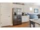 Eat-in kitchen features stainless steel refrigerator, white cabinetry, and granite countertops at 4831 Looking Glass Trl, Denver, NC 28037