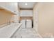Convenient laundry room with sleek countertops, cabinetry, and modern washer/dryer units at 4831 Looking Glass Trl, Denver, NC 28037