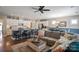 Open-concept living space with a modern kitchen, dining area, and comfortable seating, ideal for entertaining at 4831 Looking Glass Trl, Denver, NC 28037