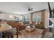 Spacious living area with a large sectional sofa, patterned curtains, and backyard view at 4831 Looking Glass Trl, Denver, NC 28037