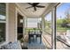 Covered patio features string lights, a patio set, and access to a lovely backyard at 4831 Looking Glass Trl, Denver, NC 28037