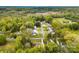 An aerial view of a community featuring homes surrounded by lush greenery and trees at 504 Ogden Dr, Gastonia, NC 28056