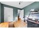 Spacious bedroom featuring wood-look floors, white trim, and a ceiling fan at 504 Ogden Dr, Gastonia, NC 28056