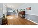 Spacious dining room featuring hardwood floors, stylish light fixture, and elegant wooden furniture at 504 Ogden Dr, Gastonia, NC 28056