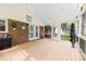 Spacious screened porch with brick accents and white trim, offering a peaceful outdoor living space at 504 Ogden Dr, Gastonia, NC 28056