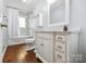 Bright bathroom with vanity, decorative mirror, and shower-tub combination at 5211 Driftwood Dr, Davidson, NC 28036