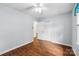 Bedroom featuring hardwood floors, ceiling fan, and neutral paint at 5211 Driftwood Dr, Davidson, NC 28036