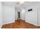 Bedroom featuring wood floors, neutral walls and an open door at 5211 Driftwood Dr, Davidson, NC 28036