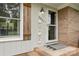 Close-up of an inviting front porch with decorative welcome signage at 5211 Driftwood Dr, Davidson, NC 28036