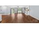 Bright living room with fireplace, wood-look floors, and ample natural light at 5211 Driftwood Dr, Davidson, NC 28036