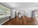 Open-concept living space featuring wood-look floors and modern finishes at 5211 Driftwood Dr, Davidson, NC 28036