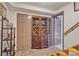 Basement hallway with decorative cabinet doors and access to multiple storage closets at 528 1St Nw Ave, Hickory, NC 28601