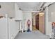 Unfinished basement area with pegboard walls and utility equipment at 528 1St Nw Ave, Hickory, NC 28601
