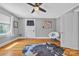 Bedroom featuring hardwood floors, white papasan chair, and ample natural light from a window at 528 1St Nw Ave, Hickory, NC 28601