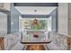 Cozy dining nook with built-in seating, a large window, and natural light at 528 1St Nw Ave, Hickory, NC 28601
