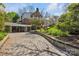 Long brick driveway leads to a brick home with an attached carport at 528 1St Nw Ave, Hickory, NC 28601