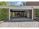 Spacious open carport with stairs leading up and a wide driveway at 528 1St Nw Ave, Hickory, NC 28601