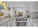 Well-lit kitchen featuring granite countertops, stainless steel oven and view to the dining area at 528 1St Nw Ave, Hickory, NC 28601