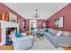 Comfortable living room with a fireplace, chandelier and a large sectional sofa at 528 1St Nw Ave, Hickory, NC 28601
