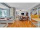 Open concept living room featuring hardwood floors, custom built-in seating and arched entryway at 528 1St Nw Ave, Hickory, NC 28601