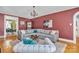 Spacious living room featuring a large sectional sofa, chandelier, and hardwood floors at 528 1St Nw Ave, Hickory, NC 28601