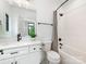 Bathroom with white vanity, marble countertop, black fixtures, and glass enclosed shower at 5511 Fairview Rd, Charlotte, NC 28209