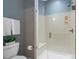 Modern bathroom features a glass shower, white toilet, and gray walls at 6311 Ridge Path Ln, Charlotte, NC 28269