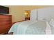 Bright bedroom with a comfortable bed, large closet, and doorway that leads to an adjacent room at 6311 Ridge Path Ln, Charlotte, NC 28269