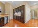 A partial kitchen view with ample storage and a stainless steel dishwasher at 6311 Ridge Path Ln, Charlotte, NC 28269