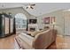 A cozy living room with a vaulted ceiling and a decorative fireplace at 6311 Ridge Path Ln, Charlotte, NC 28269