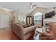A comfortable living room with vaulted ceiling and a cozy fireplace at 6311 Ridge Path Ln, Charlotte, NC 28269