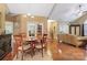 A large living room attached to a dining area with hardwood flooring at 6311 Ridge Path Ln, Charlotte, NC 28269